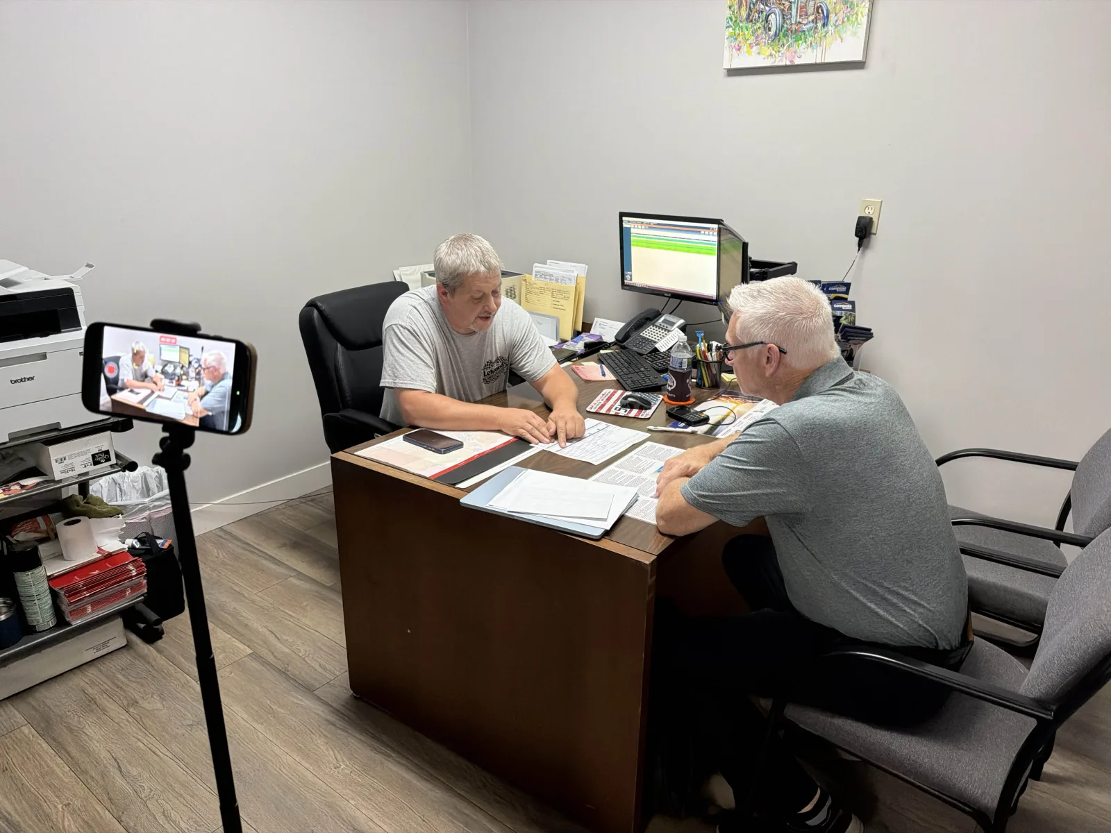 An Elite FI Partners coach recording a live menu walk on site so the finance manager can re-watch the session